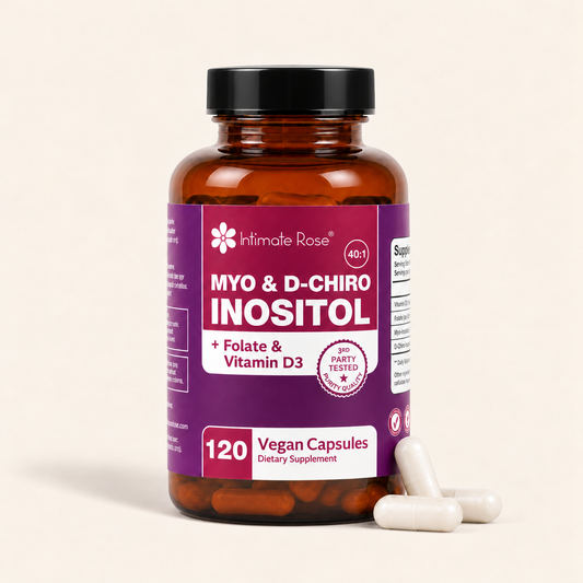 An amber glass supplement bottle with a black cap and a purple label reading Intimate Rose Myo & D-Chiro Inositol, shown on a light beige background with three white capsules in front.